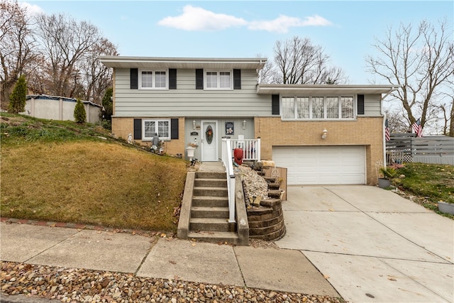 view of front of home with a garage and a front yard