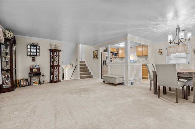 dining space with light colored carpet, ornamental molding, and a chandelier