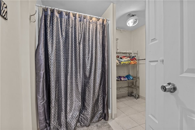 bathroom with tile patterned floors