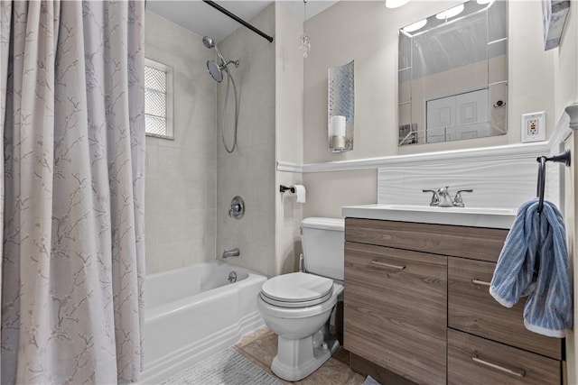 full bathroom with tile patterned floors, vanity, shower / tub combo, and toilet