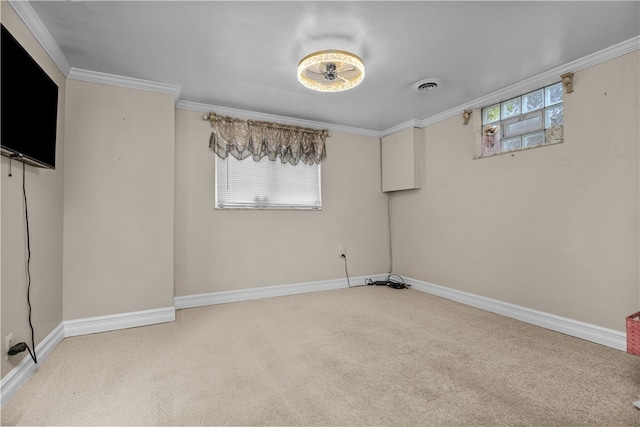 unfurnished room featuring a healthy amount of sunlight, light colored carpet, and ornamental molding