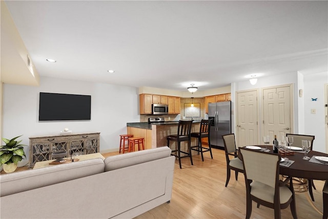 living room with light hardwood / wood-style flooring