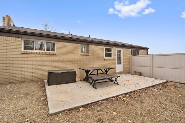 back of property with a patio and central AC unit