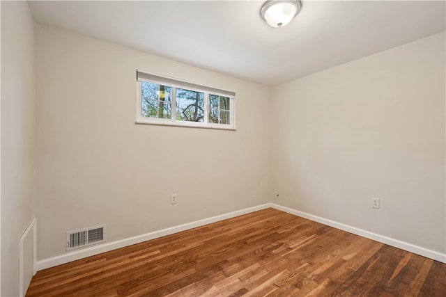 unfurnished room featuring hardwood / wood-style floors