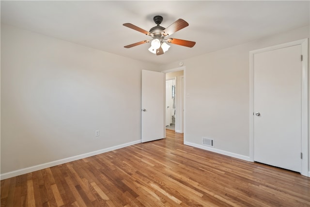 spare room featuring light hardwood / wood-style floors and ceiling fan