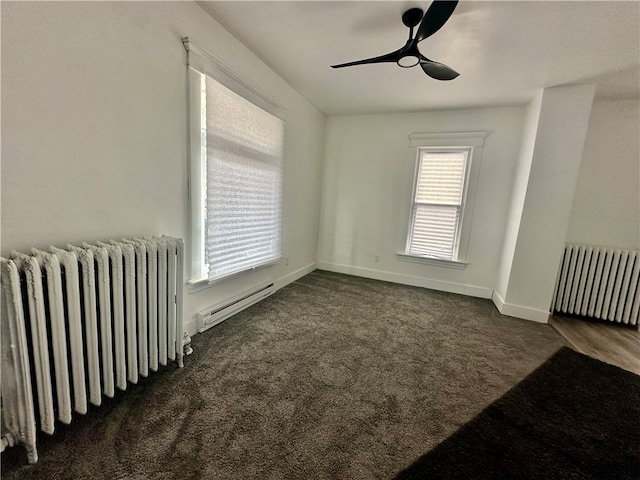 carpeted empty room with radiator, ceiling fan, and baseboard heating