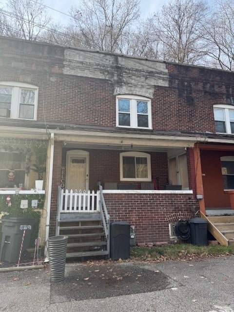 townhome / multi-family property featuring a porch