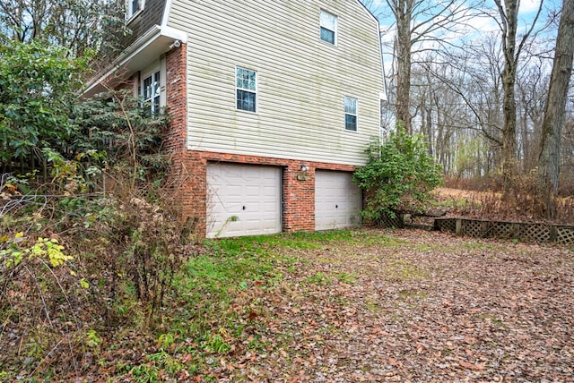 view of property exterior with a garage