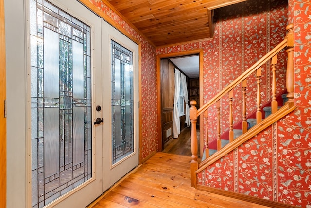 foyer with hardwood / wood-style flooring and wooden ceiling