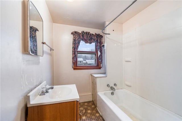 bathroom featuring tile patterned floors, shower / washtub combination, and vanity