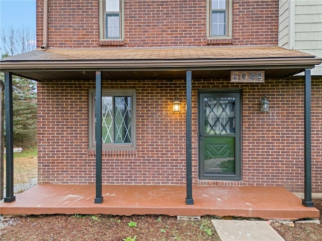 property entrance featuring covered porch