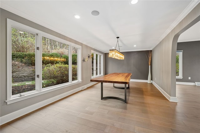 game room featuring light hardwood / wood-style floors and crown molding