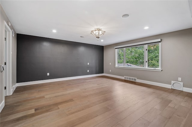 spare room with light wood-type flooring