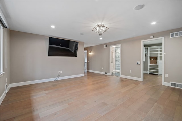 unfurnished living room featuring light hardwood / wood-style flooring