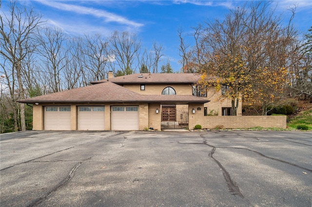 view of front of home with a garage