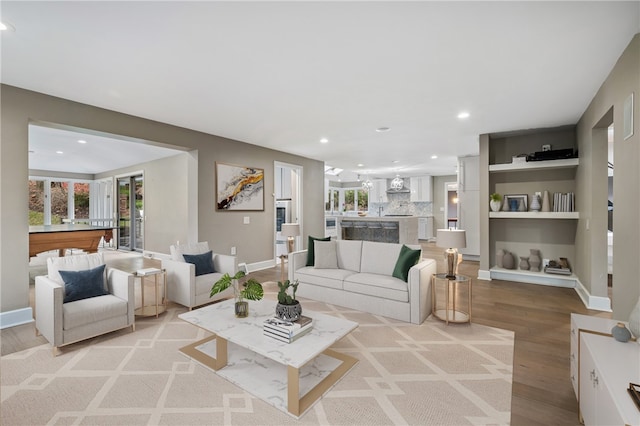 living room featuring light wood-type flooring and pool table