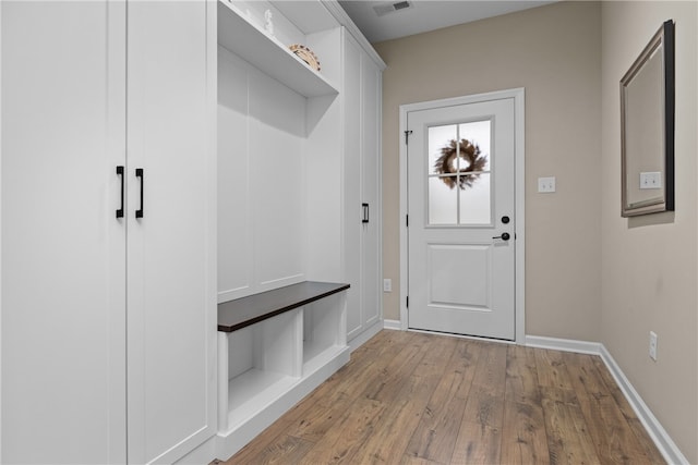 mudroom with light hardwood / wood-style flooring