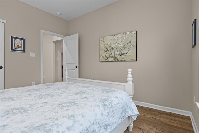 bedroom featuring dark hardwood / wood-style flooring