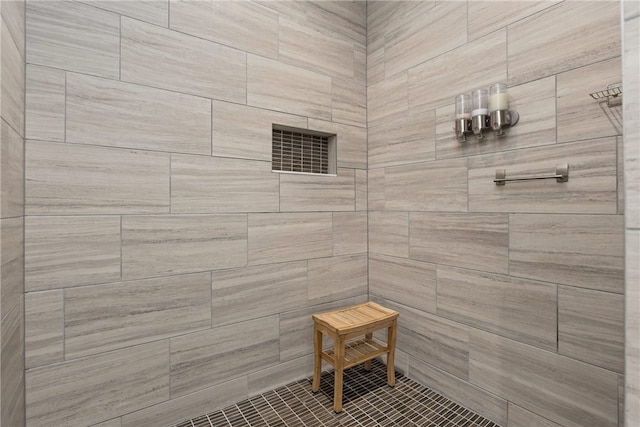 bathroom with tiled shower