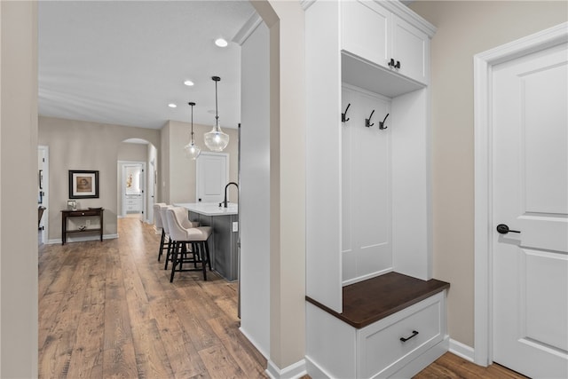 mudroom with hardwood / wood-style flooring