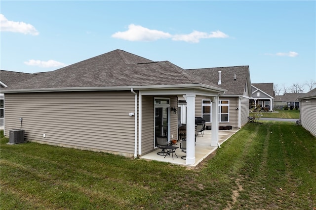 back of house featuring a patio area, a yard, and central AC unit