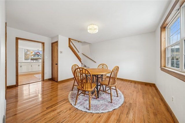 dining area with light hardwood / wood-style flooring