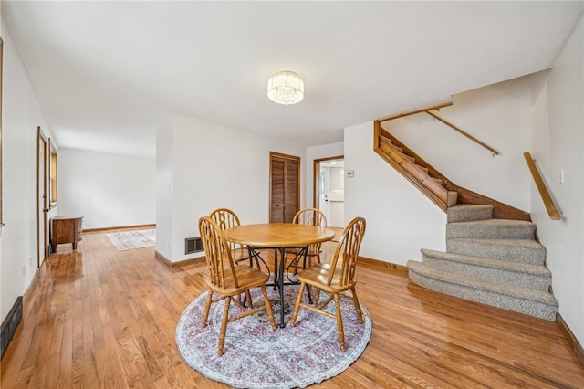 dining area with light hardwood / wood-style floors