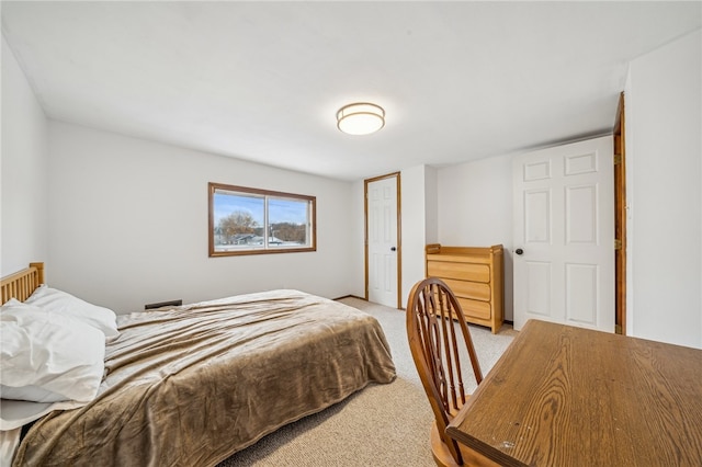 bedroom with light colored carpet