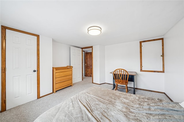 bedroom featuring light carpet