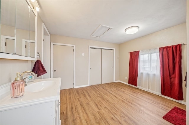 bathroom featuring hardwood / wood-style flooring and vanity