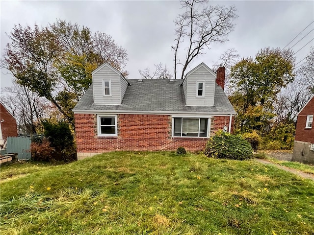 back of house with a lawn