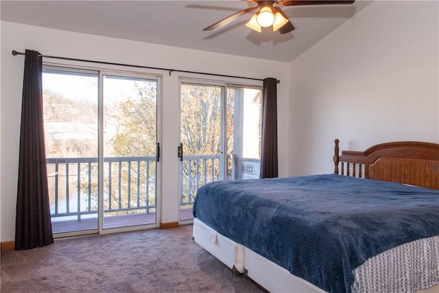 carpeted bedroom featuring access to exterior, ceiling fan, multiple windows, and vaulted ceiling