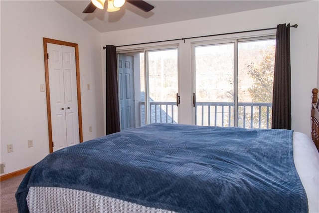 bedroom with access to exterior, ceiling fan, carpet floors, a closet, and lofted ceiling