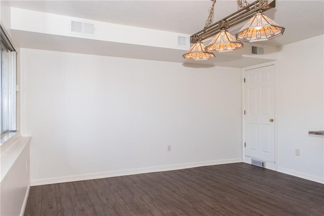 unfurnished room with dark hardwood / wood-style floors