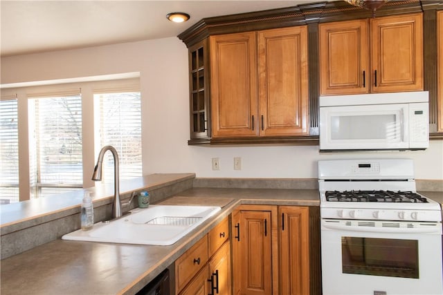 kitchen featuring sink and white appliances