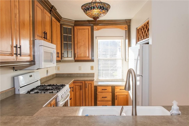 kitchen with white appliances and sink