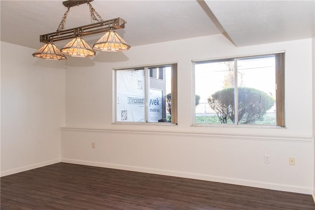 spare room with dark wood-type flooring