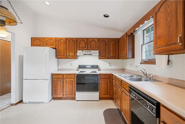 kitchen featuring white appliances, sink, and vaulted ceiling