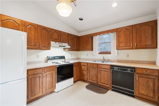 kitchen featuring white appliances, vaulted ceiling, and sink