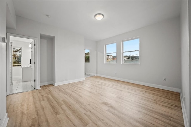 spare room with light hardwood / wood-style floors