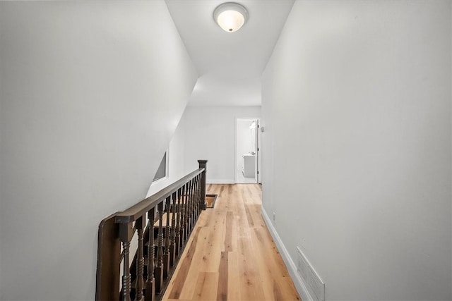 hall with light wood-type flooring