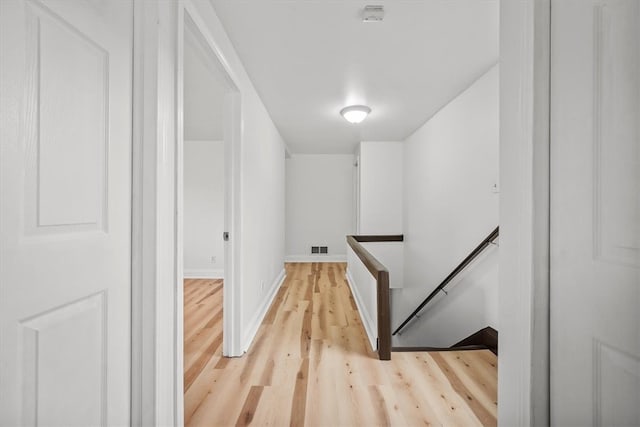 stairs featuring wood-type flooring