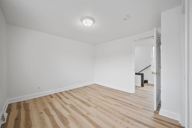 unfurnished room featuring light wood-type flooring