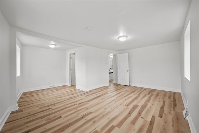 spare room featuring light hardwood / wood-style floors