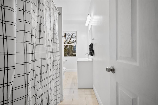 interior space with sink and light tile patterned floors