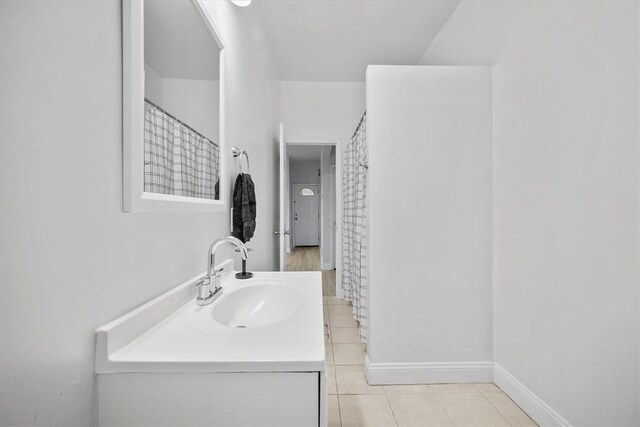 810 Hays St, Homestead, PA 15120 - bathroom featuring tile patterned flooring, vanity, and a shower with curtain