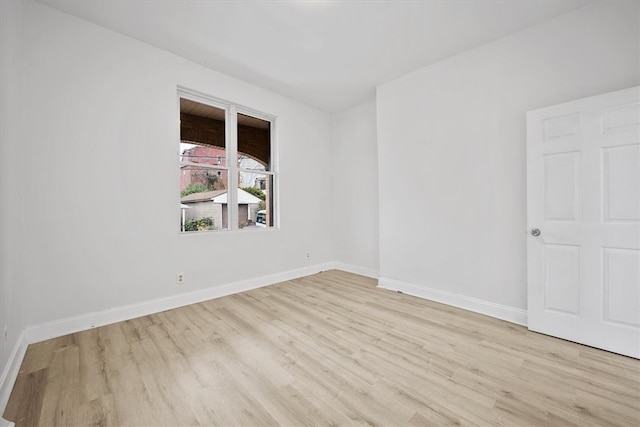 unfurnished room with light wood-type flooring