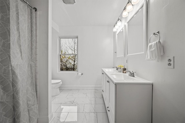 bathroom featuring vanity, toilet, and walk in shower