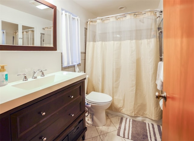 bathroom with a shower with shower curtain, vanity, and toilet