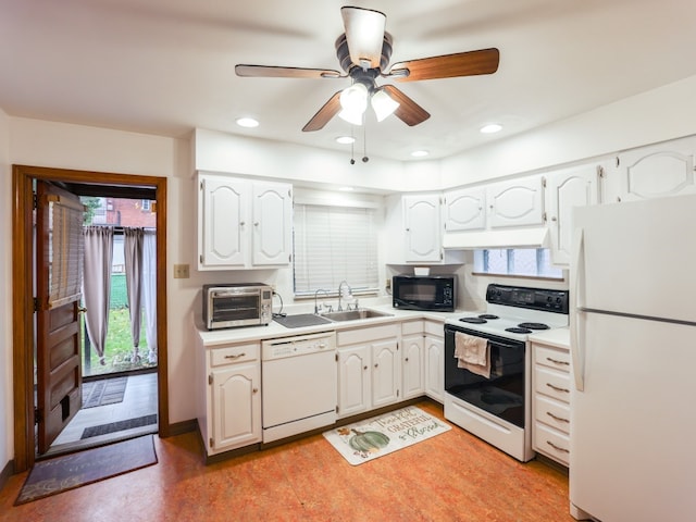 kitchen with white cabinets, white appliances, ceiling fan, and sink